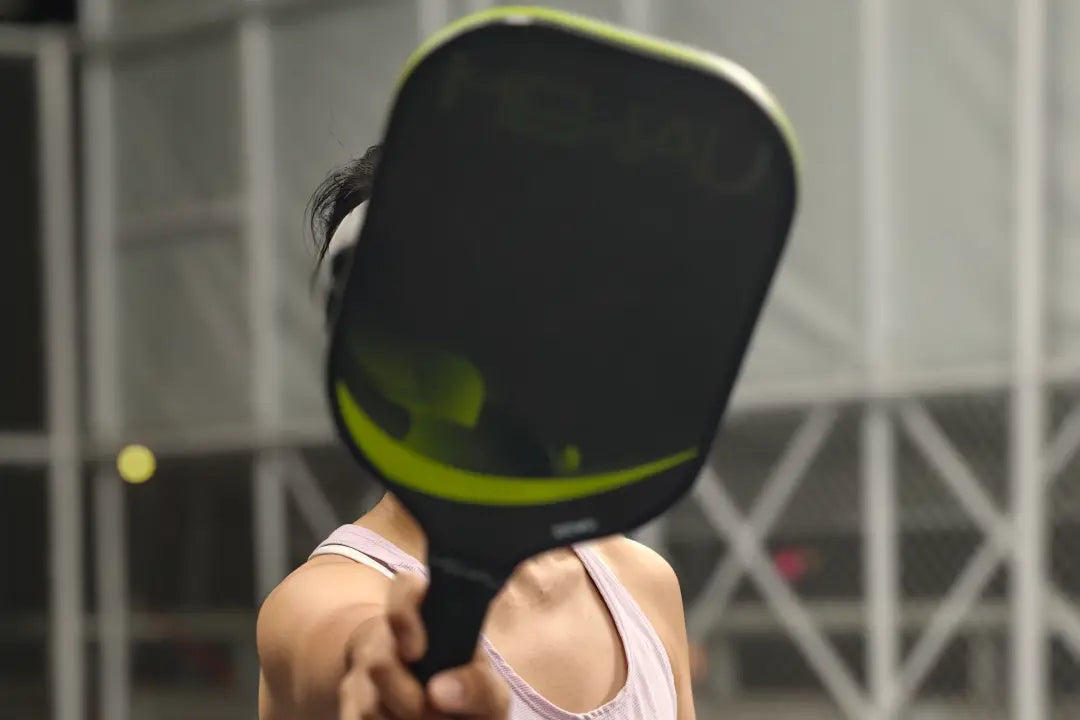 a girl is holding S5 pickleball paddle